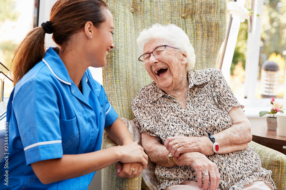 Nurse showing companionship with senior